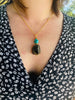 Lady wearing the Black Tourmaline and Turquoise necklace, handmade in London