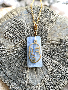kyanite blue stone with face in brass by full moon designs